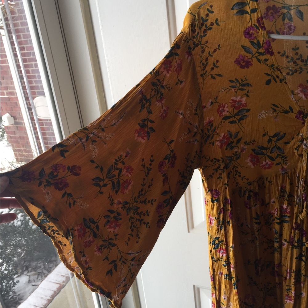Floral mini dress with bell sleeves.